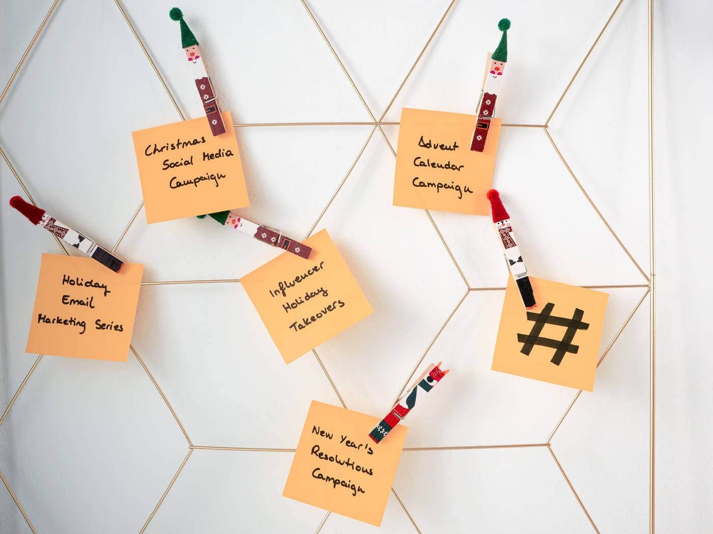 Sticky notes pegged to a wall grid, each naming a campaign to publish